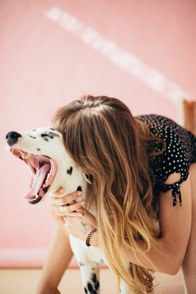 caucasian woman and her dalmation
